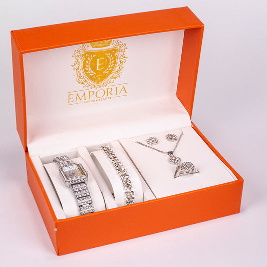 Set premium Emporia, compus din 5 piese în tonuri argintii, prezentat într-o cutie cadou exclusivă cu aspect de piele (ceas, brățară, colier, cercei și inel, decorate cu cristal alb Emporia).