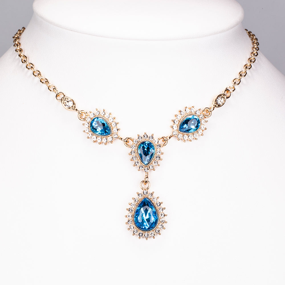 Set din Aliaj Placat cu Aur ( 32 grame ) cu Cristal Albastru Emporia® și Cristal Alb Emporia® ( Colier+Cercei+Brățară ) 3 